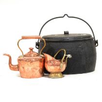 A collection of copper and cast iron wares,