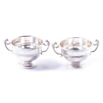 Two small silver vases,