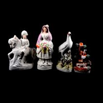A collection of Staffordshire flatback figures,