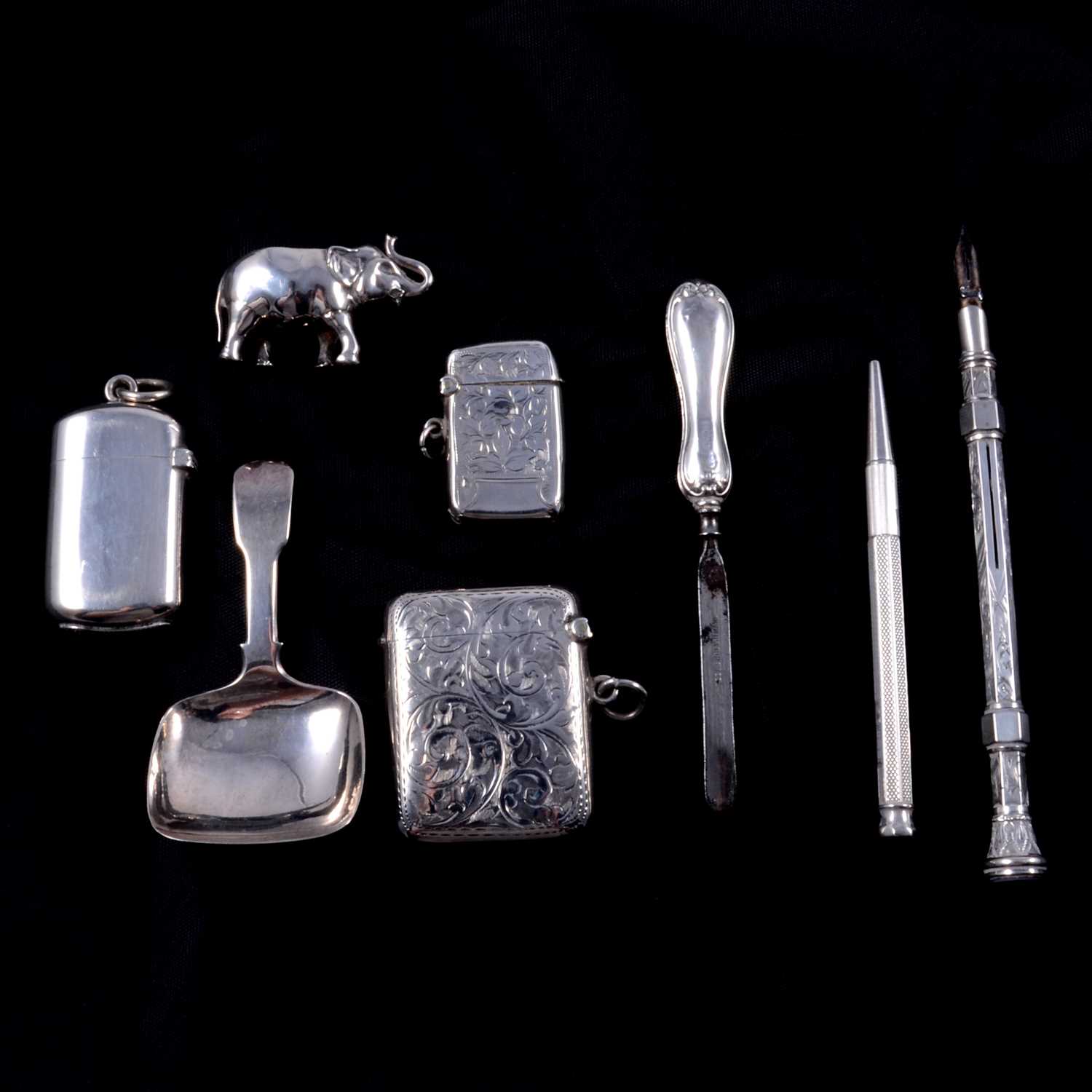 George IV silver caddy spoon, Elephant pin cushion, vestas, etc