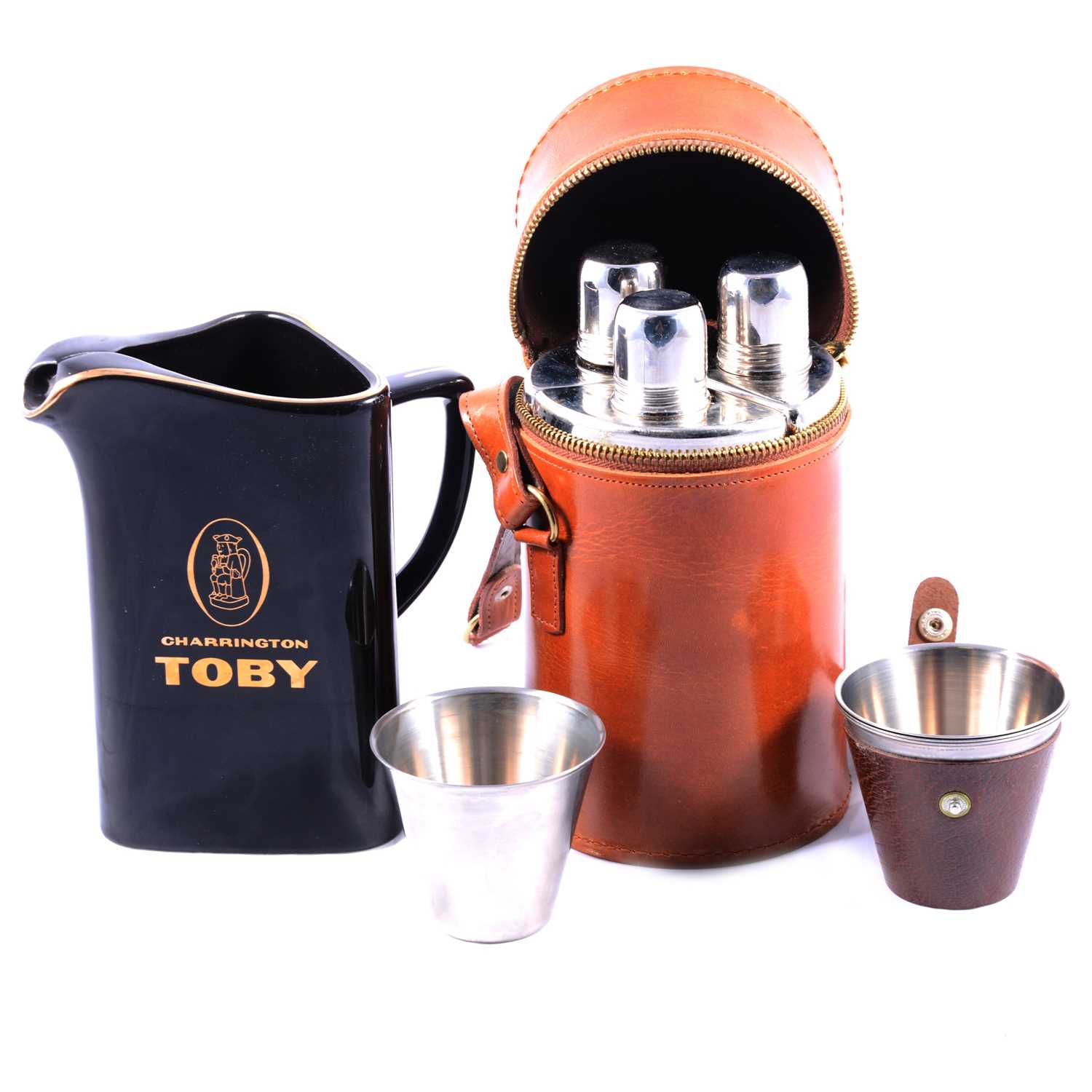 Three-bottle hunting flask, toddy cups, and a Charrington Toby whisky water jug.