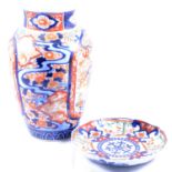 Three Imari chargers, similar dish, and a vase