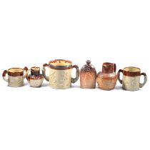 Stoneware Loving cup with a silver collar other cups, jug and a flask,