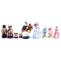 Eleven Royal Doulton figurines, two toby jugs and two character jugs.