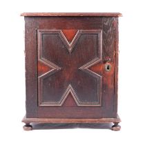 Oak table cabinet with a small collection of fossils,