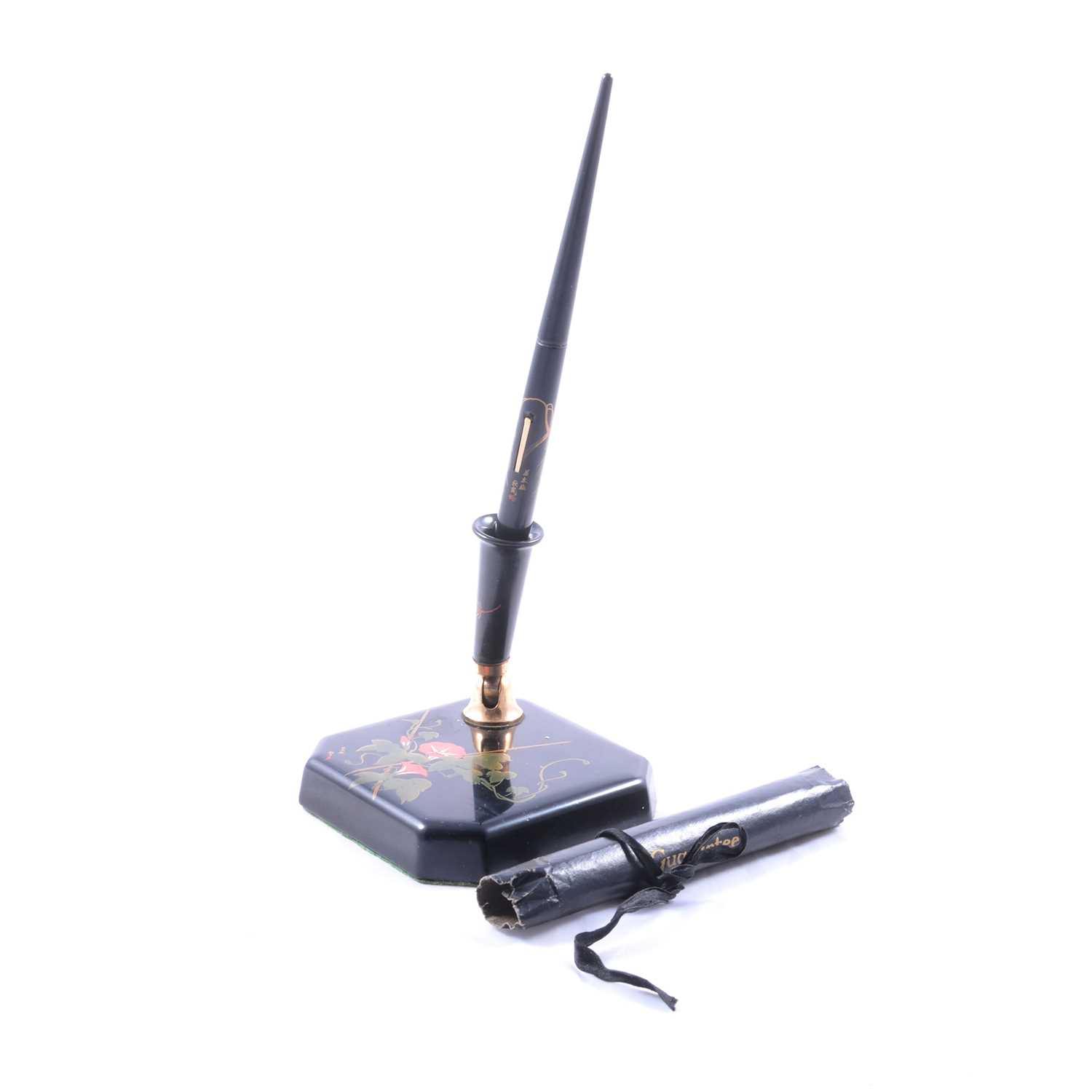 Dunhill Namiki fountain pen on square form desk stand, with paperwork,
