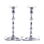Pair of George II cast silver candlesticks,