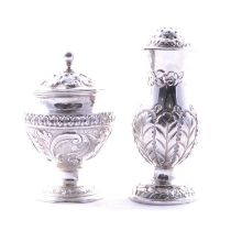 Two silver pepperettes,