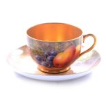 Royal Worcester matched teacup and saucer, fruit painted,
