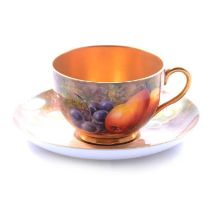 Royal Worcester matched teacup and saucer, fruit painted,