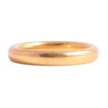 A 22 carat yellow gold wedding band.