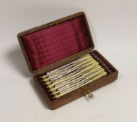 A cased set of cut throat razors, faux ivory handles, Monday - Sunday etched on blades