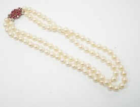 A double strand cultured pearl choker necklace with yellow and white metal, ruby and diamond cluster