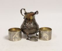 A Victorian silver baluster cream jug, London, 1846, 95mm, a pair of Victorian silver napkin rings