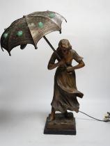 A spelter Art Nouveau-style figural table lamp, lady with an umbrella, 46cm high