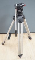 A Sachtler pro broadcast and cine camera, tripod and head, in plastic flight tube, 104cm high