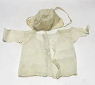 An early 18th century Hollie point insertion baby’s linen vest, three baby bonnets with Hollie point