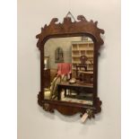 An 18th century walnut fret cut wall mirror, width 58cm, height 84cm