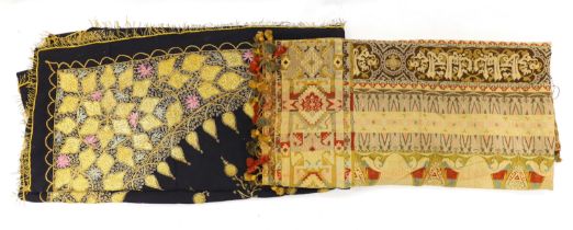 An Indian gold thread and coloured silk floss embroidered black wool cover with gold thread fringing