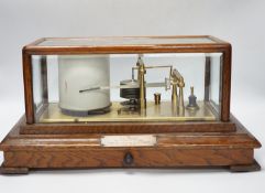 A Negretti and Zambra oak-cased barograph, number R/20613 with plaque reading ‘To C.C. Prigge as a