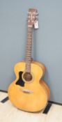 A Tanglewood acoustic guitar (left handed)