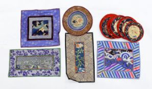 A Kesi Chinese woven panel, a Beijing knot mat, two other embroidered panels, a circular mat