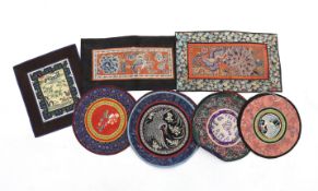 Three Beijing knot silk embroidered rectangular mats with damask borders, seven circular bird