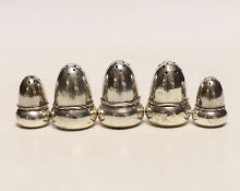 Two pairs of small Edwardian silver acorn pepperettes, the largest, Birmingham, 1903, 36mm and one