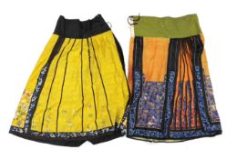 A late Chinese Qing yellow silk damask wedding skirt, with polychrome coloured silk embroidery,