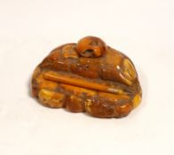 A carved amber inkstand, 15.5cm wide