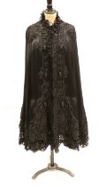 A Victorian black silk and tape lace opera cape, with black pleated chiffon collar