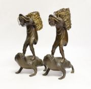 A pair of Japanese bronze boys on a toads, 22cm