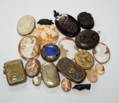 Five assorted unmounted carved cameo shells, largest 57mm, four other mounted cameo brooches