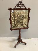 A Victorian rosewood polescreen, inset Japanese embroidered panel, decorated with a tiger, height