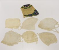 Seven baby bonnets, late 18th / 19th century, including a fine bobbin lace bonnet and unusual silk