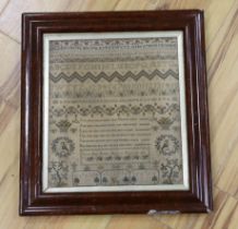 A framed early Victorian very finely worked cross stitch alphabet and spot motif sampler, dated