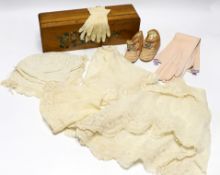 A pair of early 20th century quilted baby shoes, a pair of baby’s gloves, a lady’s pair of pink
