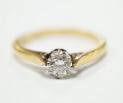 An 18ct, plat and solitaire diamond ring, size O, gross weight 3.1 grams.