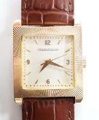 A gentleman's 18ct gold Jaeger LeCoultre manual wind dress wrist watch, with square dial, milled