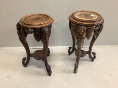 A pair of Chinese carved hardwood elephant jardiniere stands, height 73cm