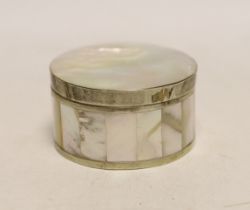 A white metal mounted mother of pearl circular box and cover, diameter 62mm.