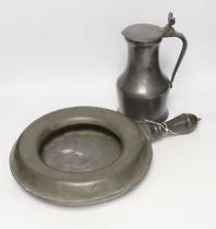 An 18th/19th century pewter measure and an 19th century pewter pan, 46cm long