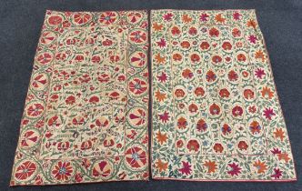 Two Uzbekistan Suzani, late 19th / early 20th century, embroidered hangings, on thick cotton,