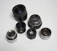 A collection of lenses for still cameras, including examples by Schneider-Kreuznach, Wray, Aldis,
