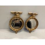 A pair of Regency style circular gilt framed wall mirrors, width 46cm, height 69cm