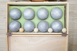 Two wooden-cased Petang sets