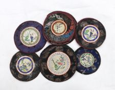 Thirty assorted Chinese silk circular mats, all embroidered with figures, all bordered with silk