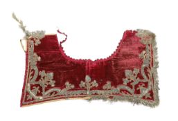 A burgundy velvet and silver thread embroidered and fringed saddle blanket, possibly Italian or