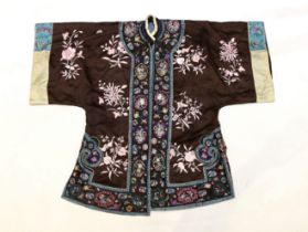 A Chinese early Republic blue silk embroidered robe with colourful ornately embroidered sleeve bands