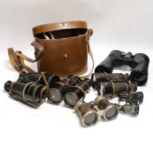 Seven pairs of binoculars including some early 20th century examples, a pair by Ross, etc.